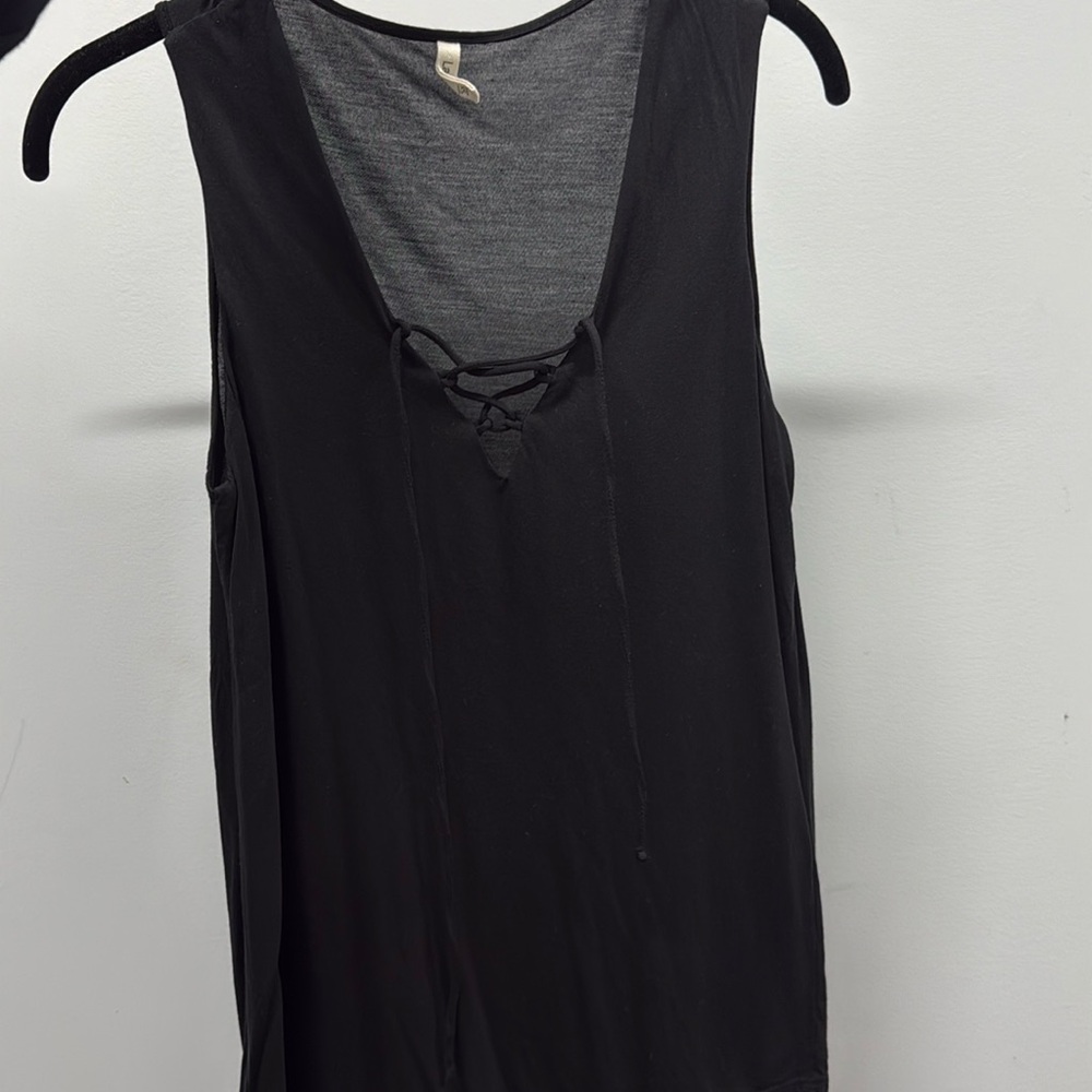 Sleeveless top with lace up detail.
